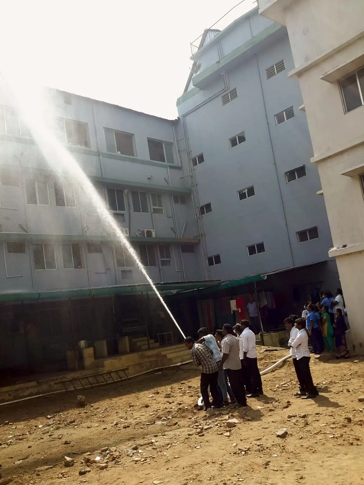 Testing a hydrant hose against a multi-storey building