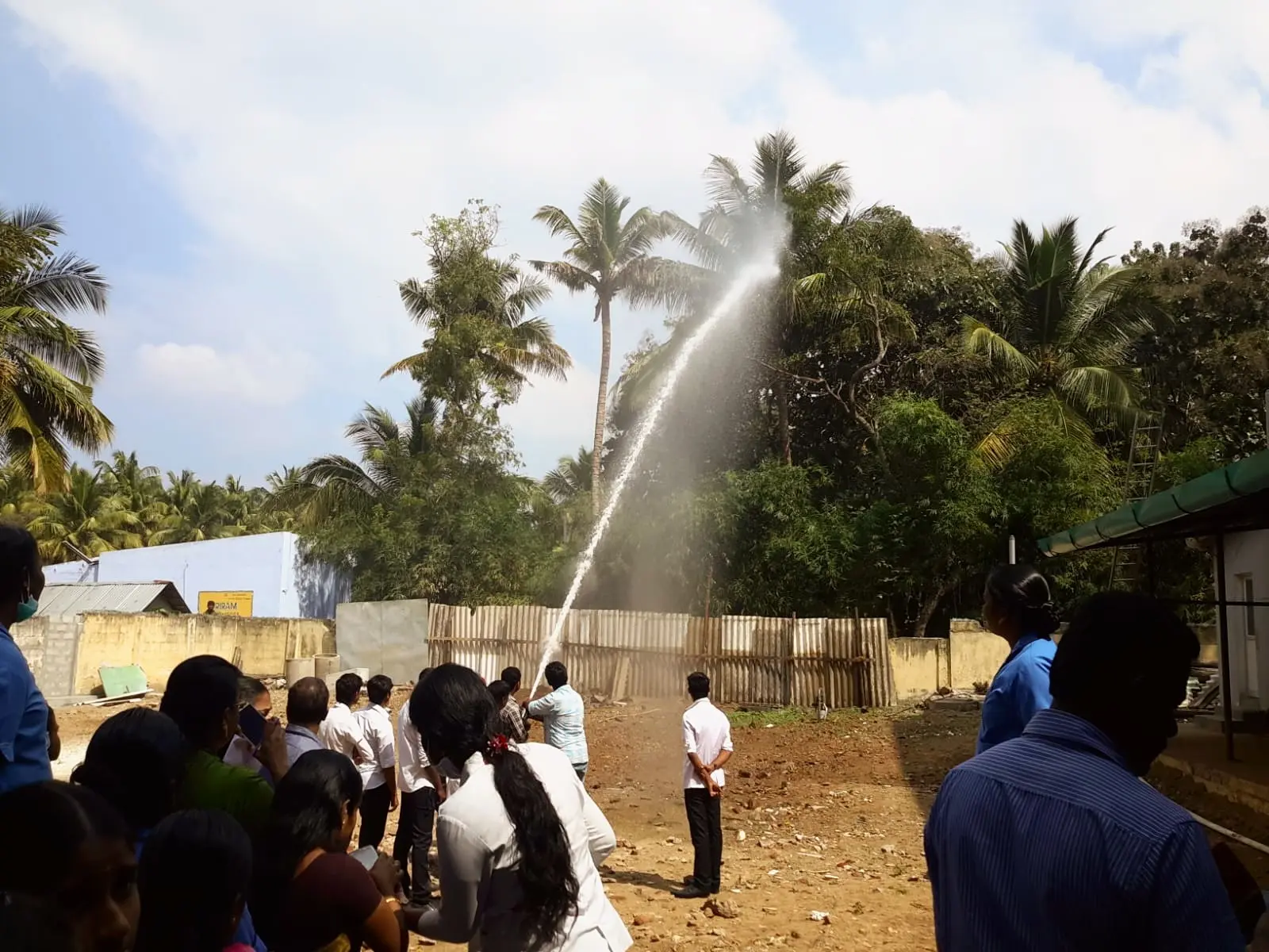 A hydrant hose jet at full pressure during a fire drill
