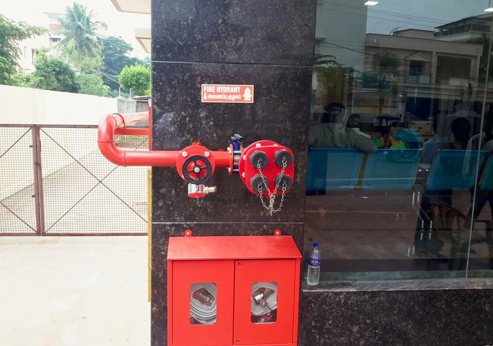 Hydrant landing valve and hose box at a building entrance