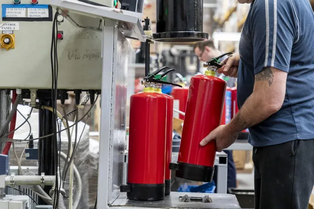 Factory floor with extinguishers in production
