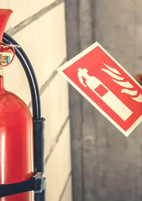 Fire extinguisher mounted on a wall bracket