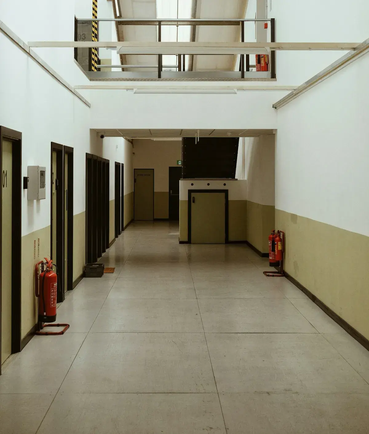 College corridor with fire extinguishers on both walls